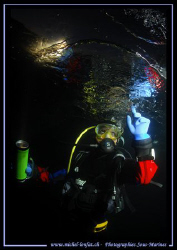 "Touching the ice" - Night fall dive under the Ice. Faby ... by Michel Lonfat 